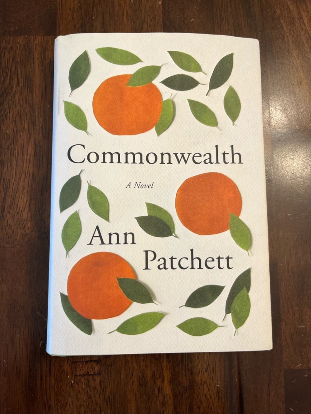 Commonwealth by Ann Patchett - White Cover with Orange & Green Design
